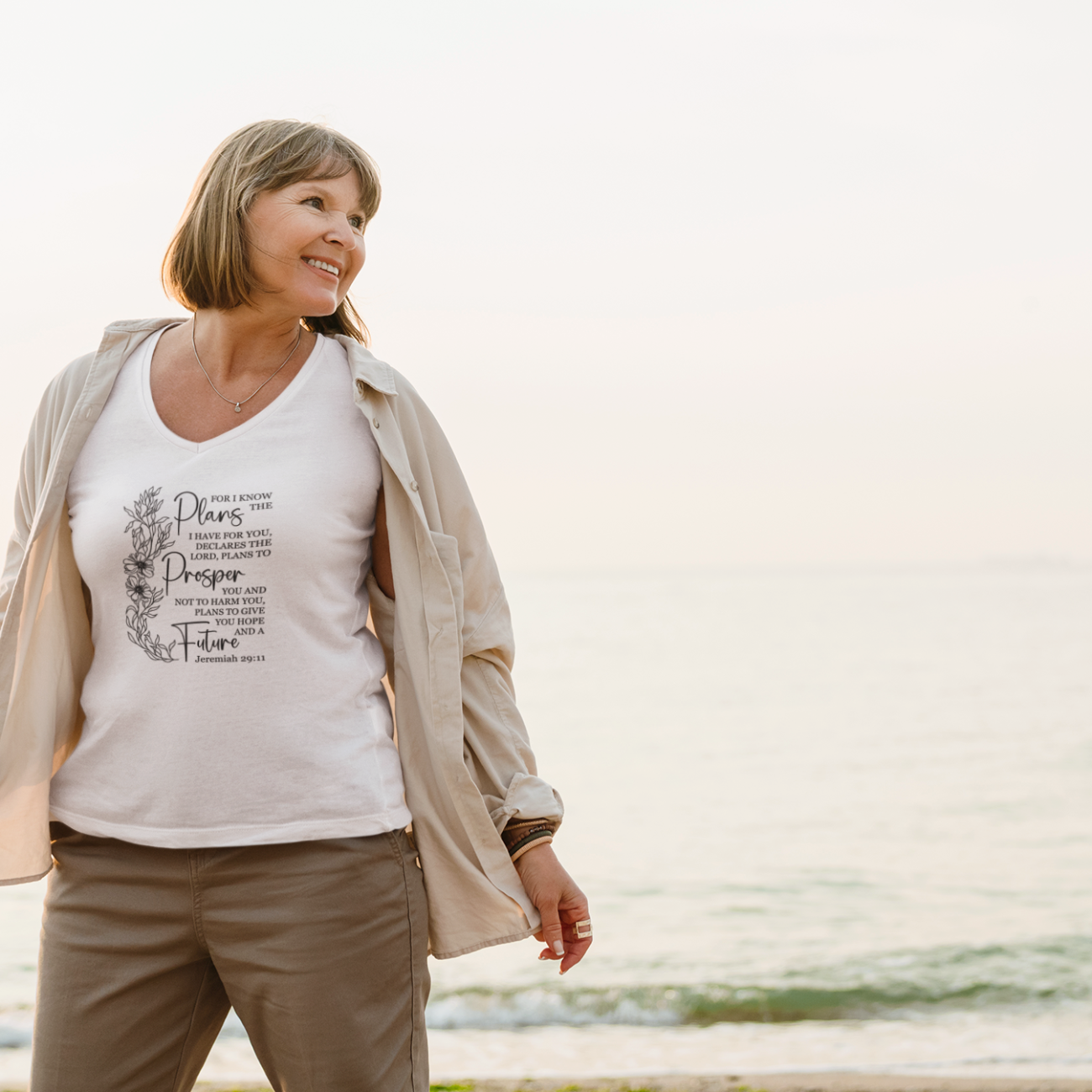 mockup-of-a-senior-woman-posing-with-a-v-neck-t-shirt-on-the-beach-m28580-r-el2